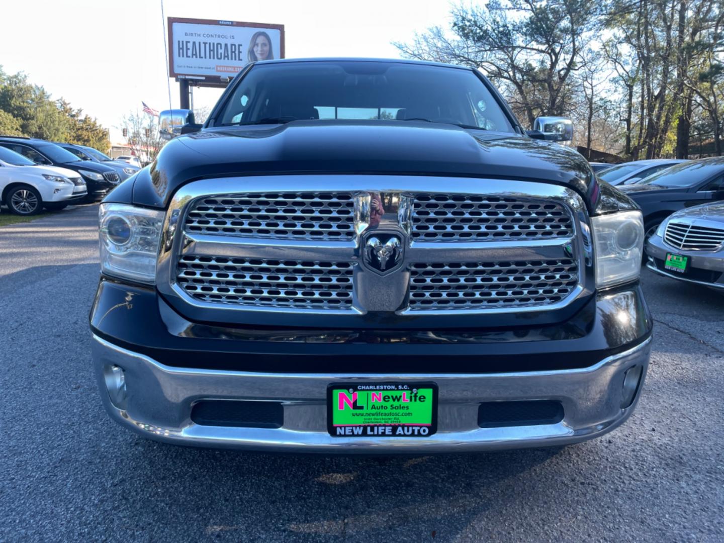 2014 BLACK RAM 1500 LARAMIE (1C6RR6VTXES) with an 5.7L engine, Automatic transmission, located at 5103 Dorchester Rd., Charleston, SC, 29418-5607, (843) 767-1122, 36.245171, -115.228050 - Photo#1